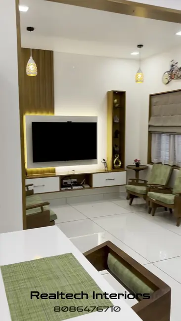 Dining and living space by Realtech Interiors