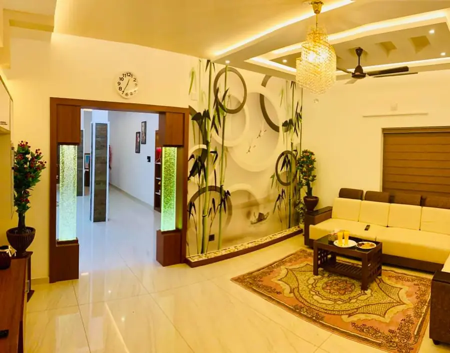 Living room with chandelier, wall mural and sofa layout